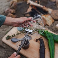 GrandPa's FireGrill parrilla plegable sobre fondo blanco